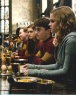 Harry y Ginny con el Uniforme de Quidditch junto a Hermione en el Gran Comedor